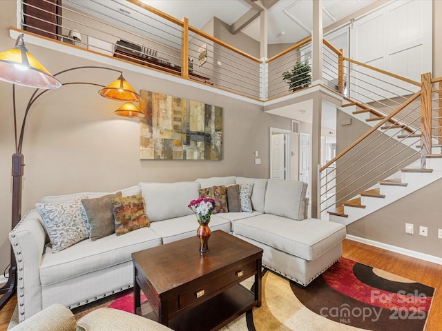 9237 N Vicksburg Park Ct, Charlotte, NC 28210 - living area with wood finished floors, stairway, and a high ceiling