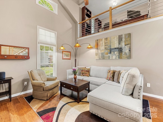9237 N Vicksburg Park Ct, Charlotte, NC 28210 - living room with healthy amount of natural light, wood finished floors, and a towering ceiling