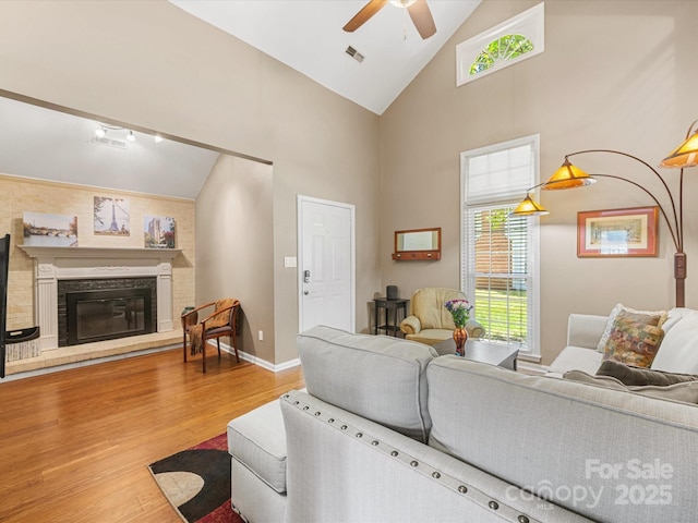 9237 N Vicksburg Park Ct, Charlotte, NC 28210 - living area with ceiling fan, high vaulted ceiling, wood finished floors, and a glass covered fireplace
