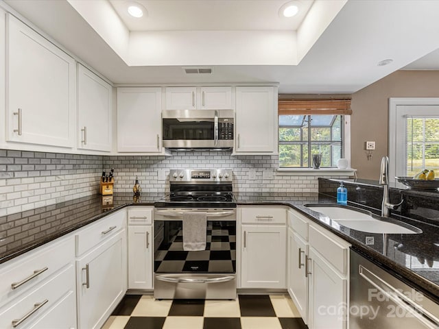 9237 N Vicksburg Park Ct, Charlotte, NC 28210 - kitchen featuring stainless steel appliances, light floors, and white cabinetry