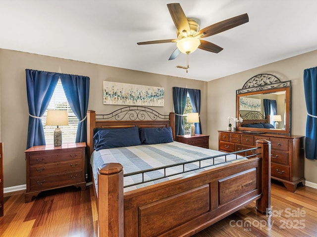 9237 N Vicksburg Park Ct, Charlotte, NC 28210 - bedroom featuring multiple windows and wood finished floors