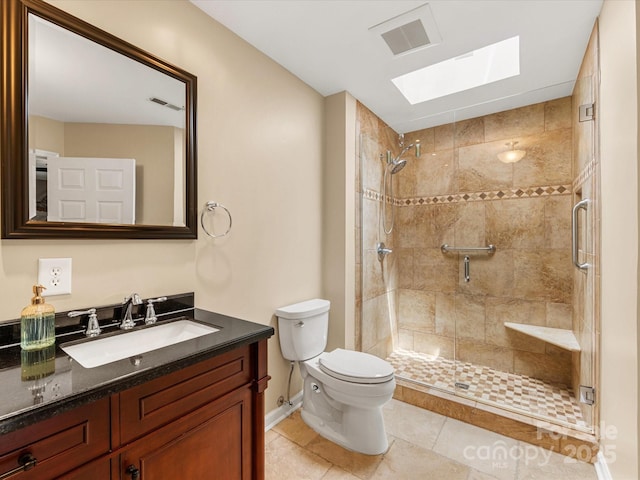 9237 N Vicksburg Park Ct, Charlotte, NC 28210 - bathroom with a skylight, vanity, a stall shower, and tile patterned floors