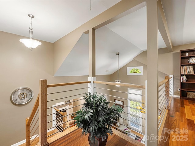 9237 N Vicksburg Park Ct, Charlotte, NC 28210 - corridor with wood finished floors, vaulted ceiling, and an upstairs landing