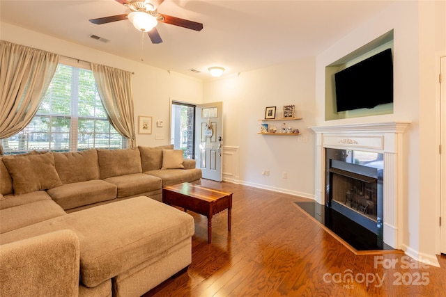 141 Leyton Loop Unit B, Mooresville, NC 28117 - living room featuring wood finished floors, ceiling fan, and a fireplace with flush hearth