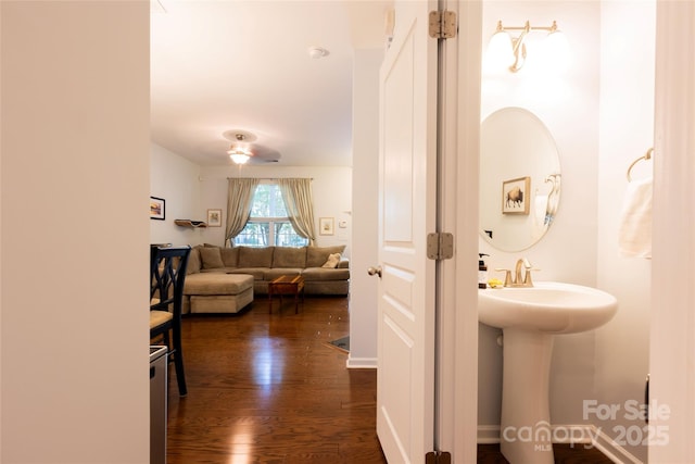 141 Leyton Loop Unit B, Mooresville, NC 28117 - corridor featuring dark wood-style floors and a sink