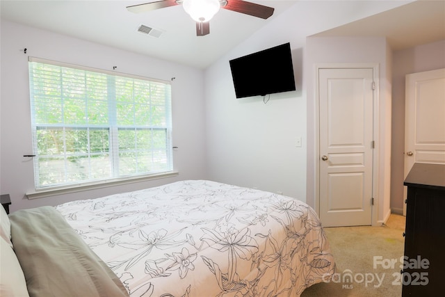 141 Leyton Loop Unit B, Mooresville, NC 28117 - bedroom featuring light colored carpet, lofted ceiling, and a ceiling fan