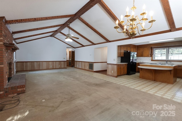 621 Big Lick Rd, Oakboro, NC 28129 - unfurnished living room with a wainscoted wall, a chandelier, light carpet, and a ceiling fan
