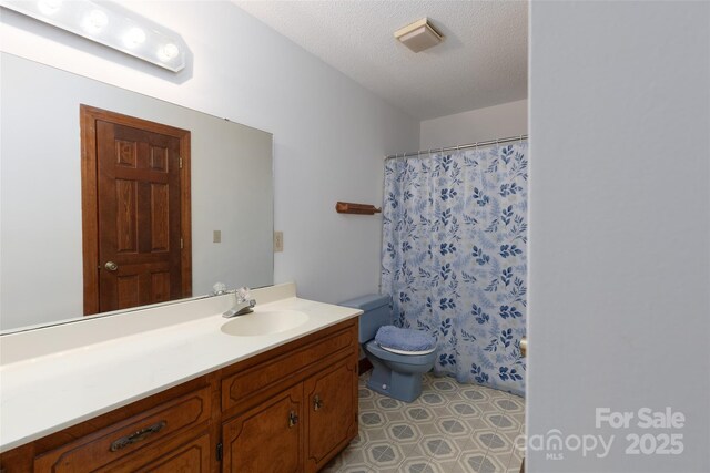 621 Big Lick Rd, Oakboro, NC 28129 - full bathroom featuring vanity, a textured ceiling, curtained shower, and tile patterned floors