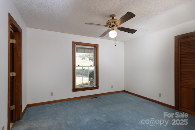 621 Big Lick Rd, Oakboro, NC 28129 - unfurnished bedroom with carpet, a textured ceiling, and ceiling fan