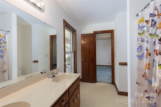621 Big Lick Rd, Oakboro, NC 28129 - full bath with double vanity, a textured ceiling, and curtained shower