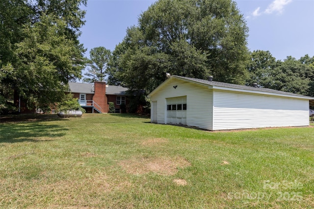 621 Big Lick Rd, Oakboro, NC 28129 - view of green lawn featuring a garage and an outbuilding