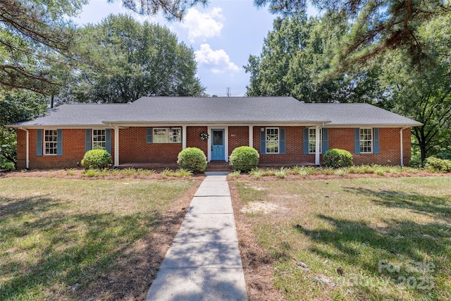 621 Big Lick Rd, Oakboro, NC 28129 - ranch-style house featuring a front lawn and brick siding