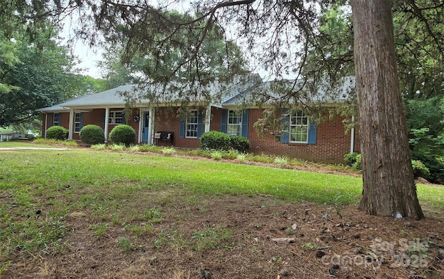 621 Big Lick Rd, Oakboro, NC 28129 - single story home featuring brick siding and a front lawn