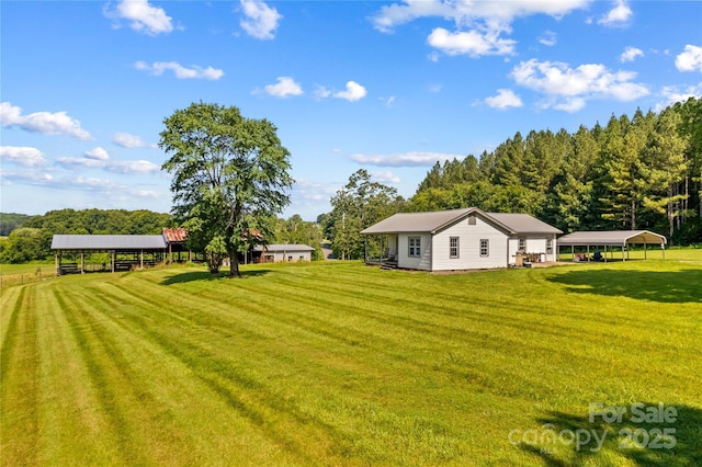 179 J And W Rd, Olin, NC 28660 - view of grassy yard featuring a carport
