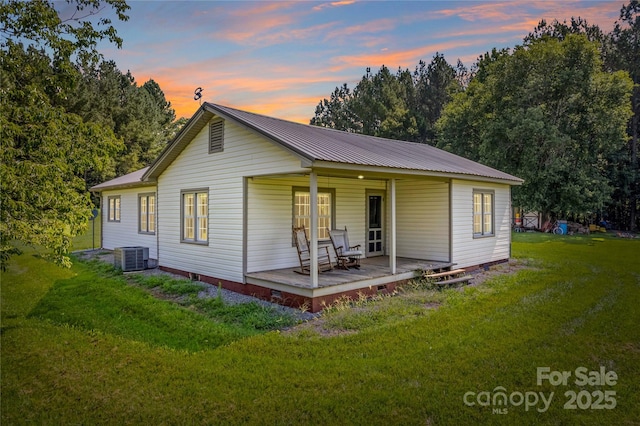 179 J And W Rd, Olin, NC 28660 - view of front of property featuring a yard, a metal roof, crawl space, and a porch