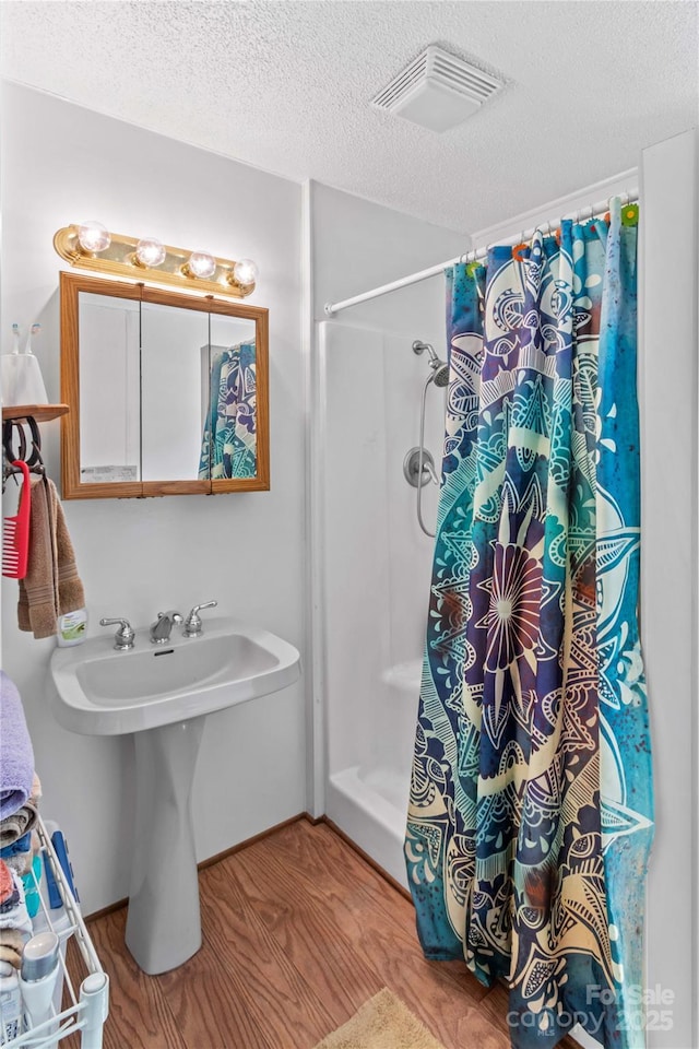 179 J And W Rd, Olin, NC 28660 - full bathroom with curtained shower and a textured ceiling