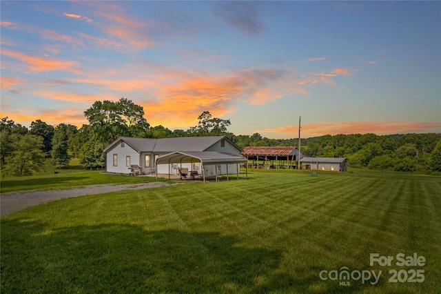 179 J And W Rd, Olin, NC 28660 - view of front of house featuring a detached carport, a yard, and driveway
