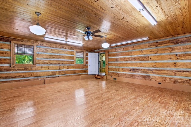 179 J And W Rd, Olin, NC 28660 - empty room featuring wooden ceiling, wood finished floors, rustic walls, healthy amount of natural light, and ceiling fan