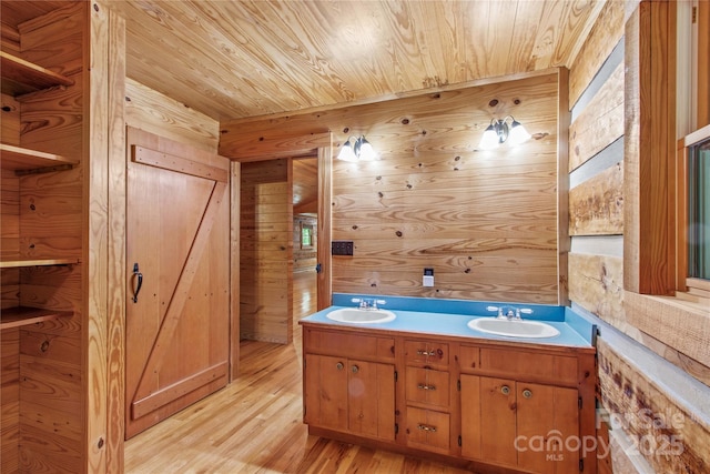 179 J And W Rd, Olin, NC 28660 - full bathroom with wooden walls, wooden ceiling, wood finished floors, and double vanity