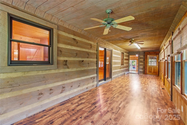 179 J And W Rd, Olin, NC 28660 - unfurnished room featuring wooden ceiling, wood walls, ceiling fan, and wood finished floors
