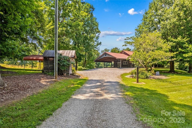 179 J And W Rd, Olin, NC 28660 - view of community featuring asphalt driveway and a lawn