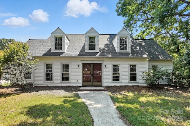 11100 Painted Tree Rd, Charlotte, NC 28226 - cape cod-style house featuring a front lawn and a shingled roof