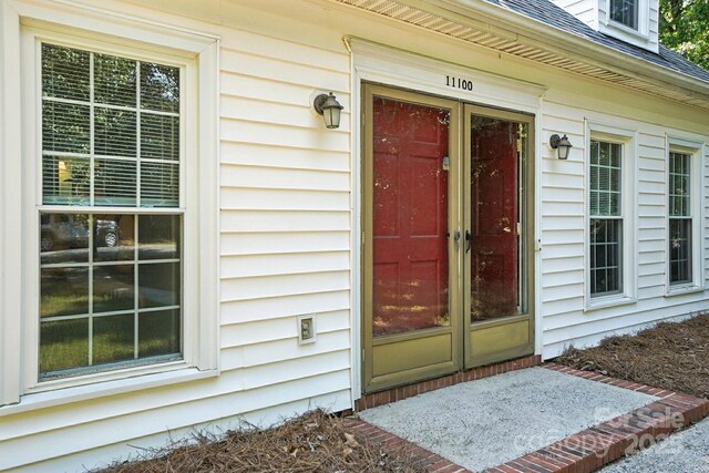 11100 Painted Tree Rd, Charlotte, NC 28226 - doorway to property with roof with shingles