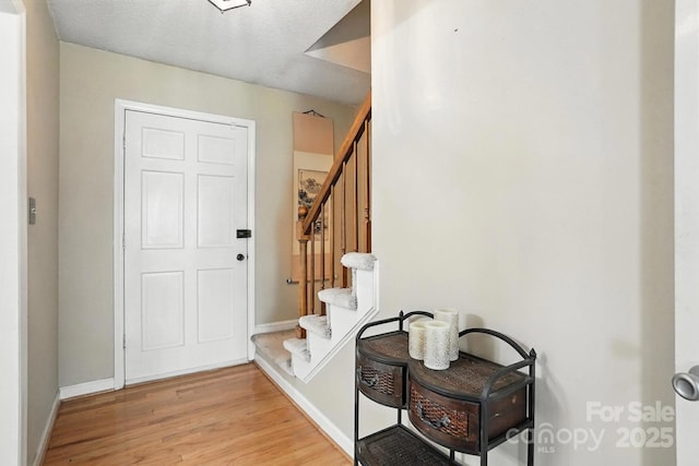 11100 Painted Tree Rd, Charlotte, NC 28226 - entryway featuring light wood-style flooring and stairs