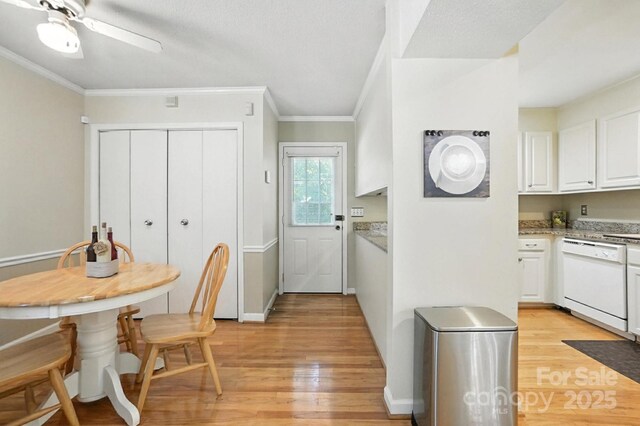 11100 Painted Tree Rd, Charlotte, NC 28226 - kitchen with dishwasher, light wood finished floors, ornamental molding, white cabinetry, and ceiling fan