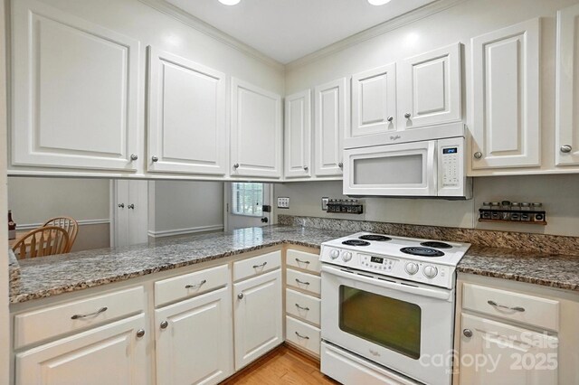 11100 Painted Tree Rd, Charlotte, NC 28226 - kitchen with white appliances, white cabinets, crown molding, stone counters, and light wood-style flooring