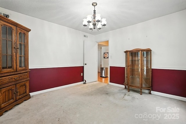 11100 Painted Tree Rd, Charlotte, NC 28226 - carpeted spare room with a chandelier and baseboards
