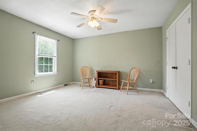 11100 Painted Tree Rd, Charlotte, NC 28226 - living area featuring carpet, a ceiling fan, and a textured ceiling