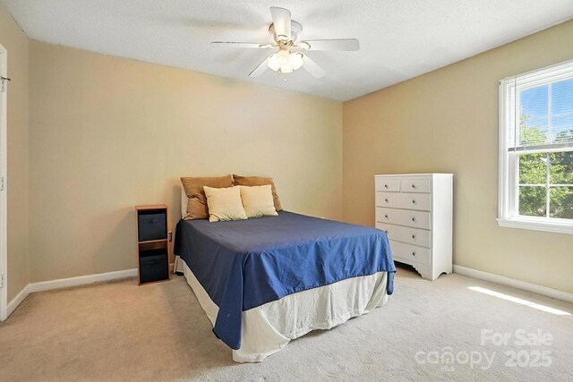 11100 Painted Tree Rd, Charlotte, NC 28226 - carpeted bedroom with baseboards and a ceiling fan