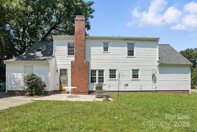 11100 Painted Tree Rd, Charlotte, NC 28226 - rear view of property featuring a chimney, a yard, a patio, and a shingled roof