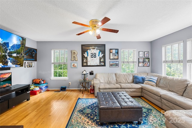 7410 Derby Meadows Ct, Charlotte, NC 28216 - living area featuring hardwood / wood-style floors, a ceiling fan, and a textured ceiling