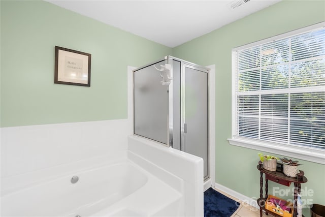 7410 Derby Meadows Ct, Charlotte, NC 28216 - bathroom featuring a garden tub, a shower stall, and tile patterned flooring