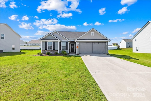 226 Caley St, Kings Mountain, NC 28086 - view of front facade with an attached garage, board and batten siding, a front lawn, and concrete driveway