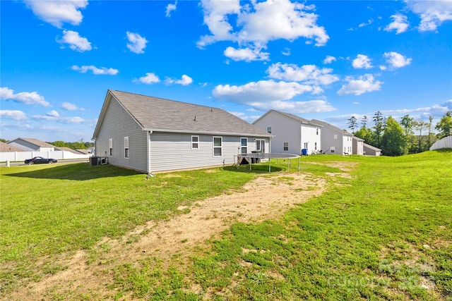 226 Caley St, Kings Mountain, NC 28086 - back of house featuring a yard, a trampoline, and roof with shingles