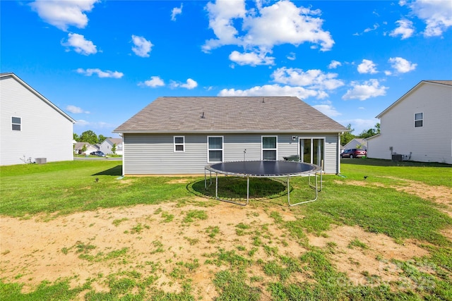 226 Caley St, Kings Mountain, NC 28086 - rear view of property with a trampoline, a yard, and roof with shingles