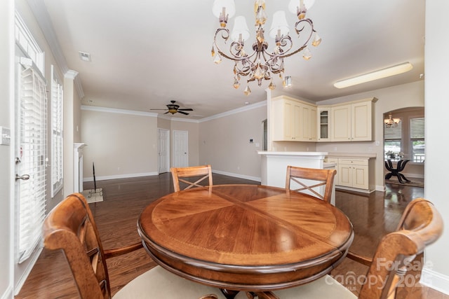 9836 Coatbridge Dr NW, Charlotte, NC 28269 - dining space with a chandelier, dark wood-style flooring, a ceiling fan, crown molding, and arched walkways