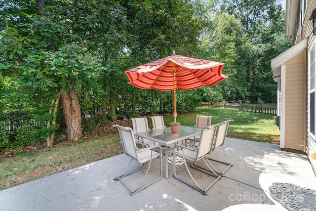 9836 Coatbridge Dr NW, Charlotte, NC 28269 - view of patio / terrace with outdoor dining space and view of scattered trees