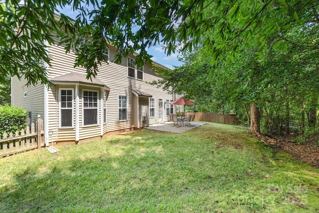 9836 Coatbridge Dr NW, Charlotte, NC 28269 - fenced backyard featuring a patio area