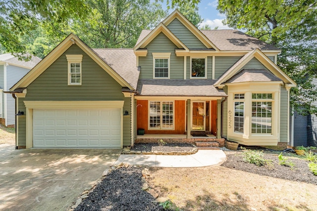 6225 Ash Cove Ln, Charlotte, NC 28269 - view of front of home featuring concrete driveway, a shingled roof, and a garage