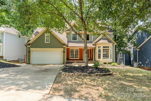 6225 Ash Cove Ln, Charlotte, NC 28269 - traditional-style home with concrete driveway, a garage, and roof with shingles