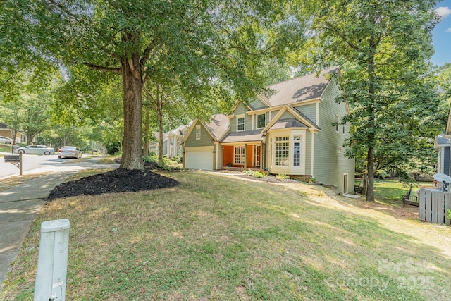 6225 Ash Cove Ln, Charlotte, NC 28269 - view of front of property featuring a garage, a front lawn, and roof with shingles