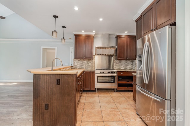 6225 Ash Cove Ln, Charlotte, NC 28269 - kitchen featuring stainless steel appliances, wall chimney range hood, a peninsula, backsplash, and light countertops