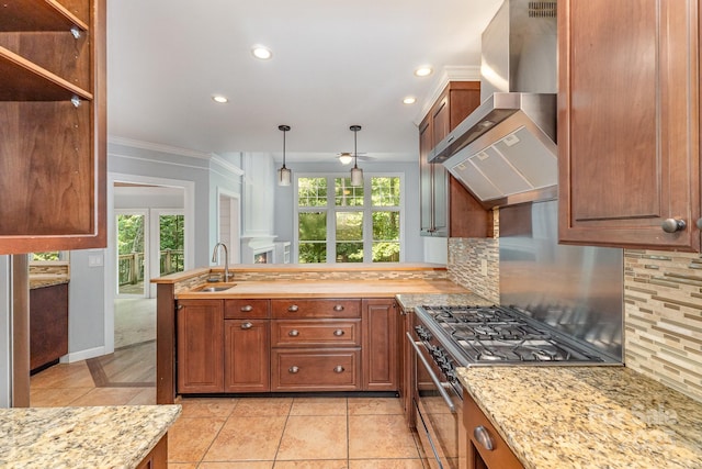 6225 Ash Cove Ln, Charlotte, NC 28269 - kitchen with wall chimney range hood, high end stainless steel range, decorative backsplash, healthy amount of natural light, and recessed lighting