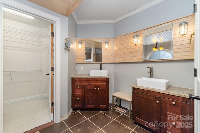 6225 Ash Cove Ln, Charlotte, NC 28269 - bathroom featuring vanity, crown molding, tile patterned floors, and a walk in closet