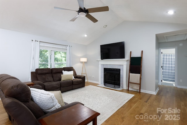 1631 Amanda Ln, Rock Hill, SC 29730 - living area featuring attic access, a ceiling fan, lofted ceiling, wood finished floors, and a tiled fireplace