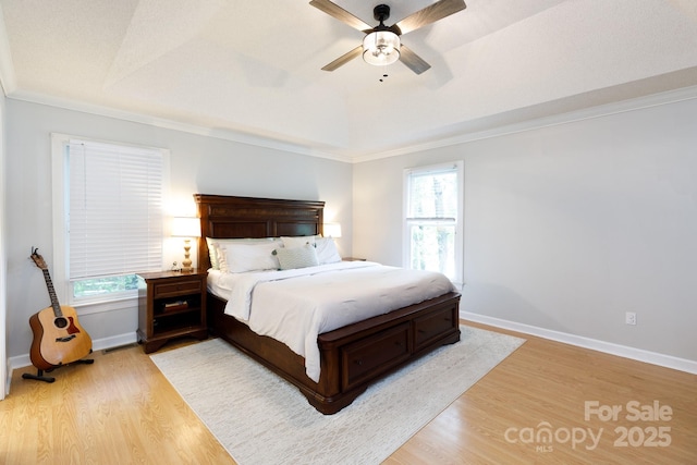 1631 Amanda Ln, Rock Hill, SC 29730 - bedroom featuring light wood finished floors, multiple windows, ornamental molding, and a ceiling fan